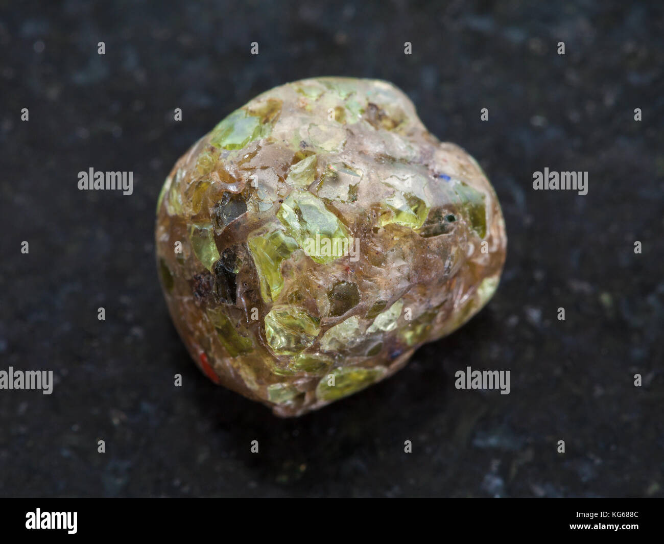 macro shooting of natural mineral rock specimen - polished Peridot ...