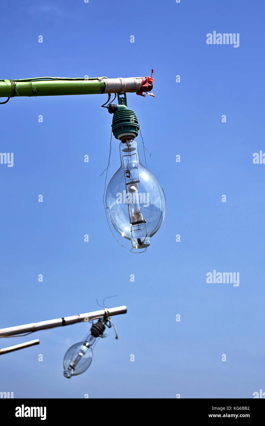 Large filament lightbulb used on Thailand fishing boat as a night navigating light. Stock Photo