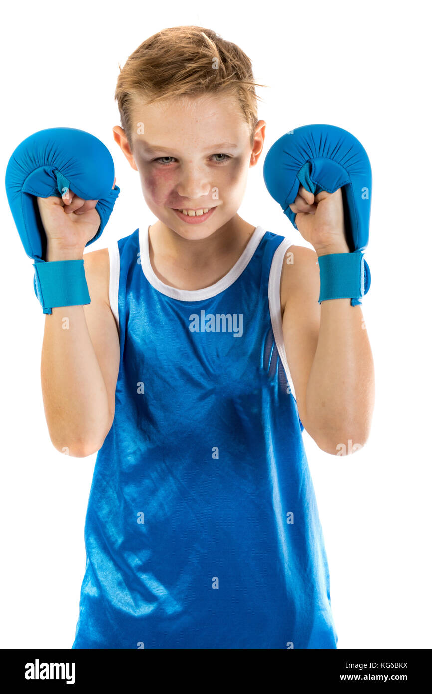 Preteen boxer boy with boxing gloves isolated against a white