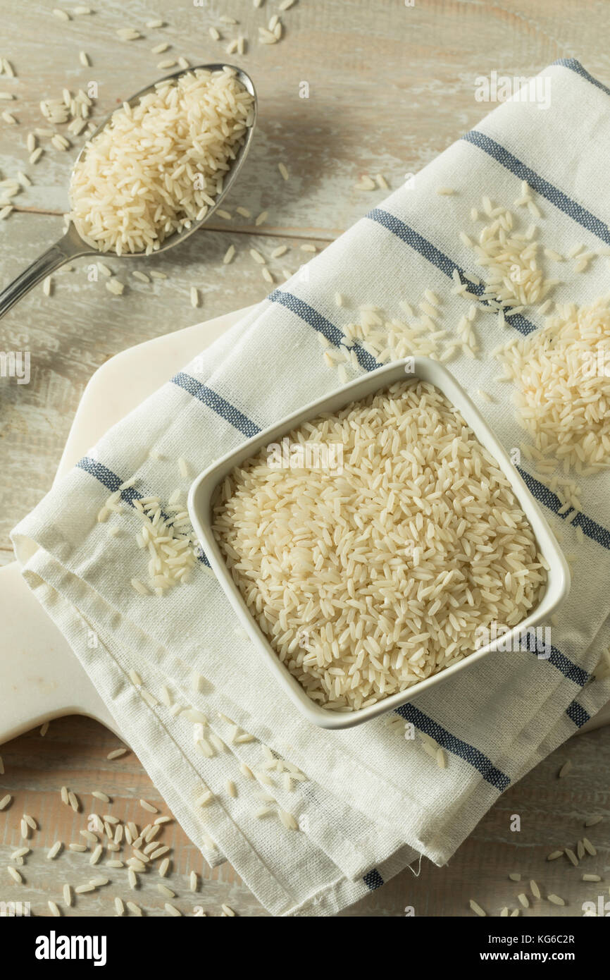 Organic Dry Long Grain White Rice in a Bowl Stock Photo
