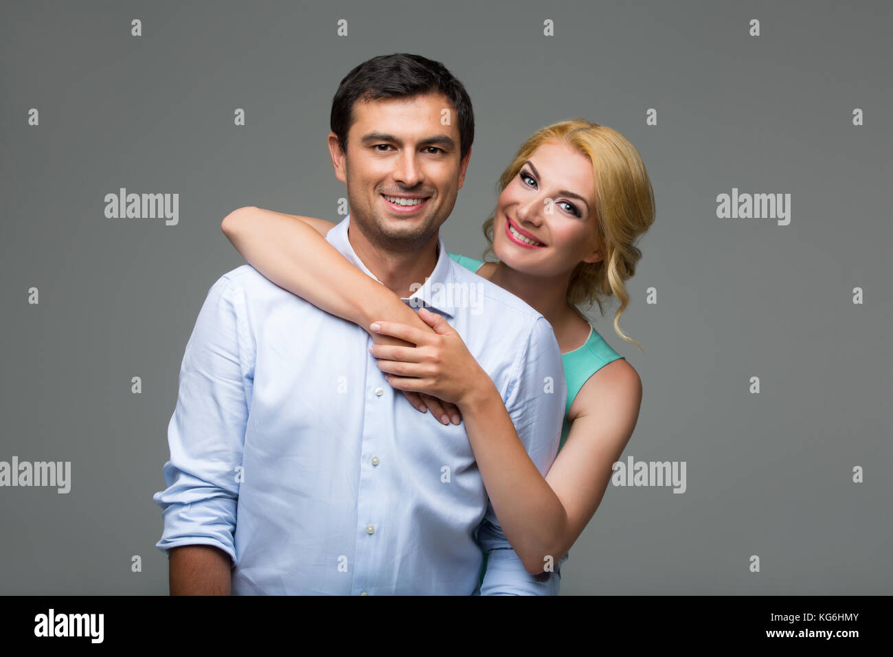 Beautiful happy couple hugging Stock Photo - Alamy