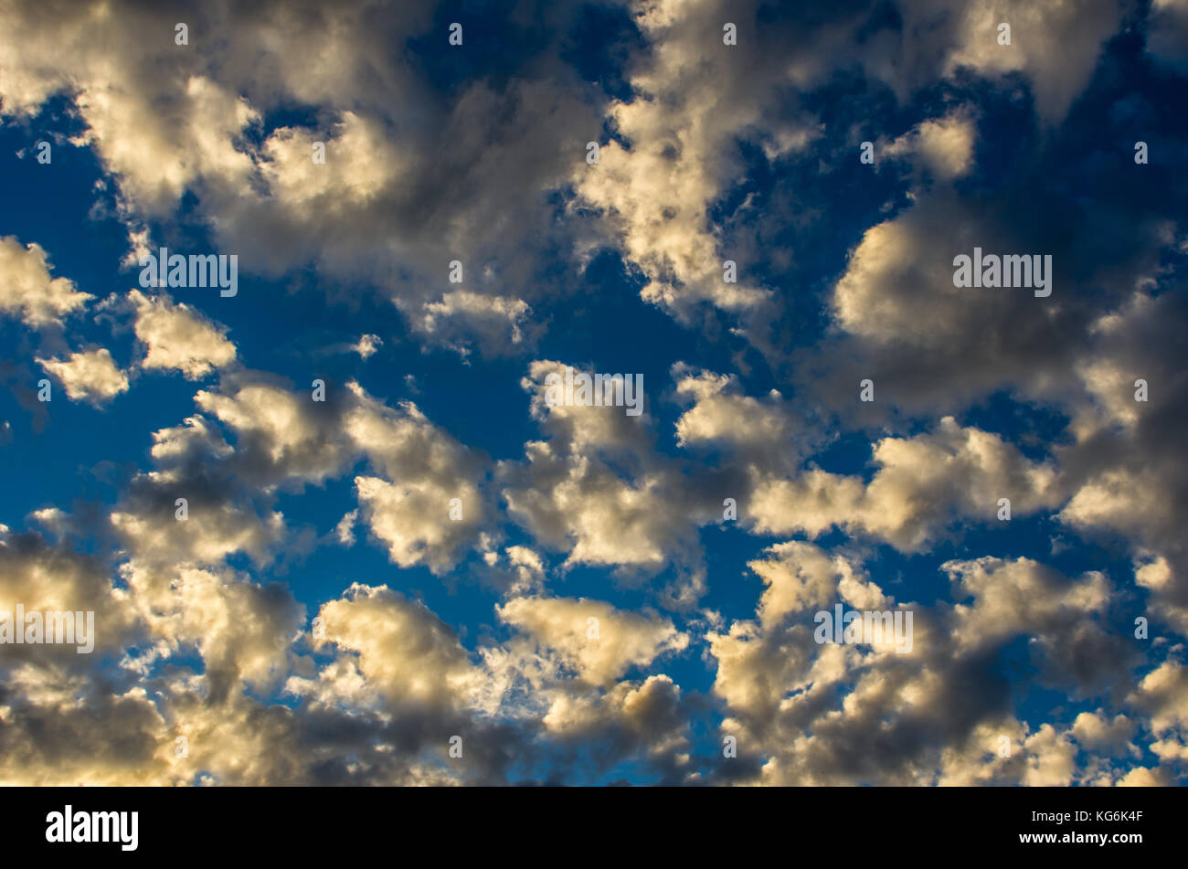 Dramatic sunset sky with golden clouds after thunderstorm Stock Photo ...