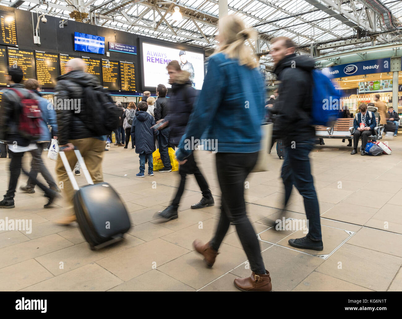Commuters rush for their train during the rush hour at Edinburgh's Waverley Station. Stock Photo