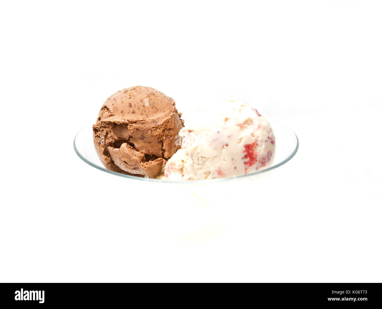 Two scoops of ice cream in a disappearing glass (focus on chocolate