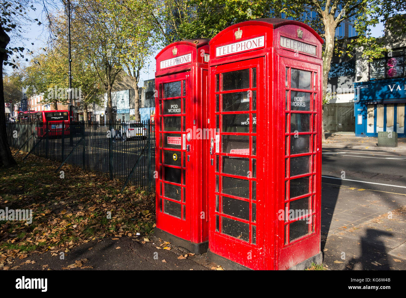 Two Pod Works micro office converted telephone kiosks, now disused and neglected, on Chiswick High Road, London, W4, UK Stock Photo