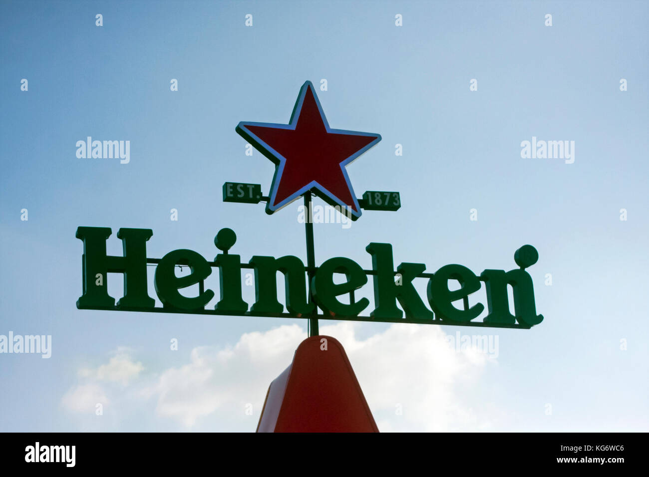 A Heineken beer logo is seen against a blue sky in Phnom Penh, Cambodia. Stock Photo