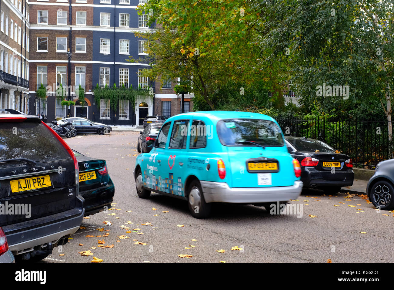 Taxi driving around Manchester Square, London UK Stock Photo