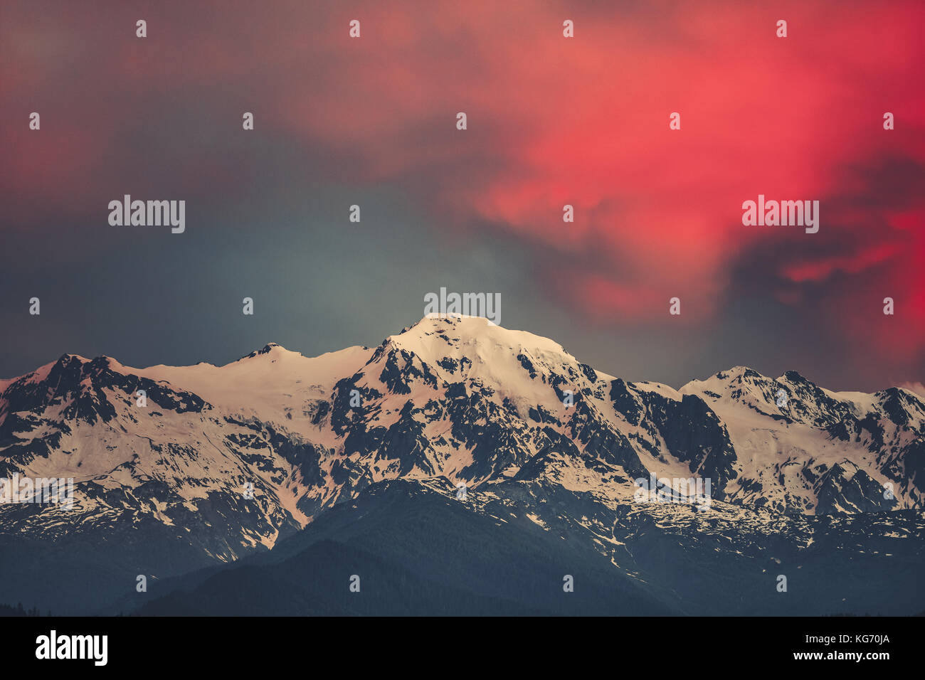 Sunset evening view over the snowy mountain peak Stock Photo - Alamy