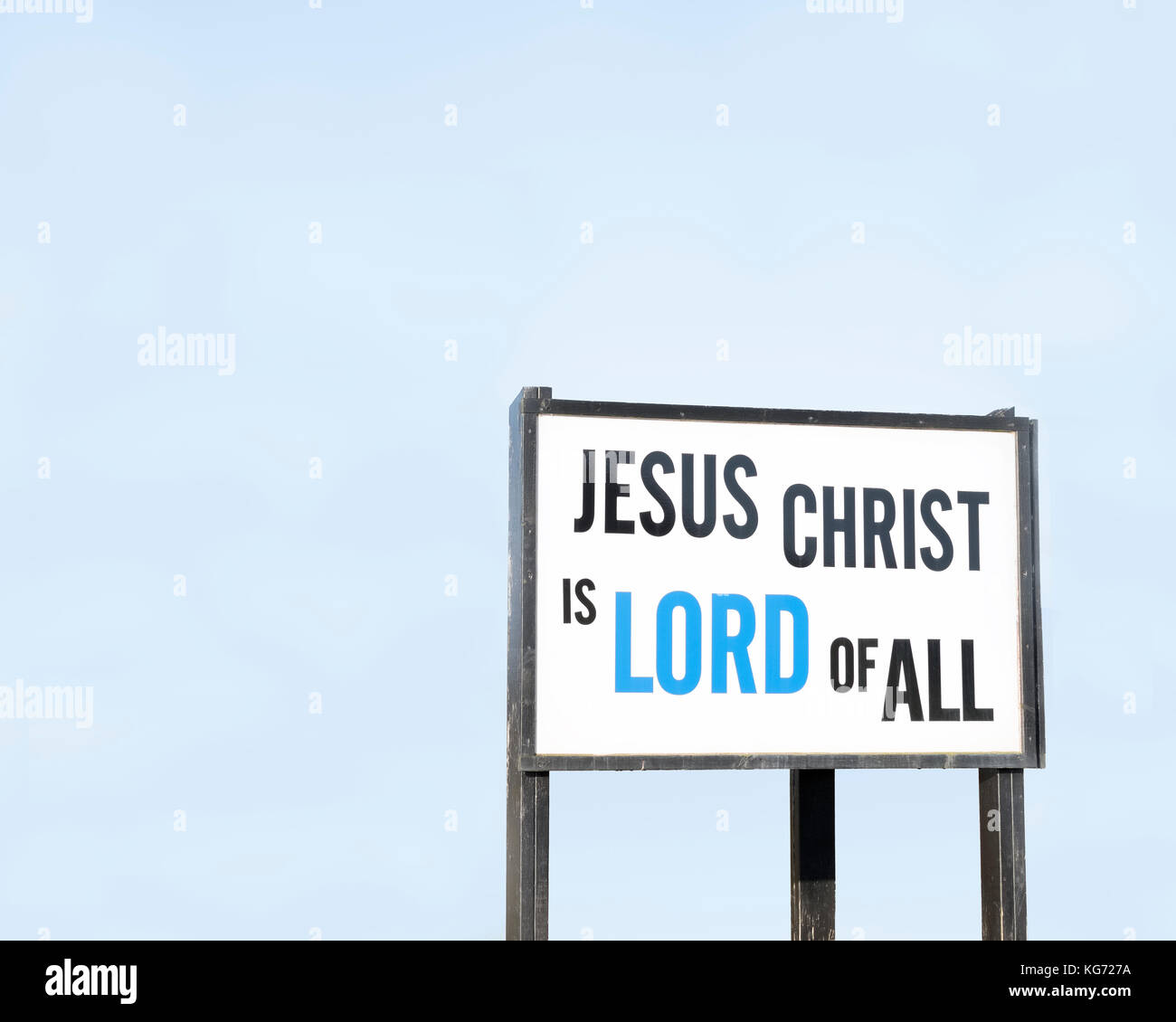 Jesus Christ Is Lord Of All Sign Against Blue Sky Stock Photo