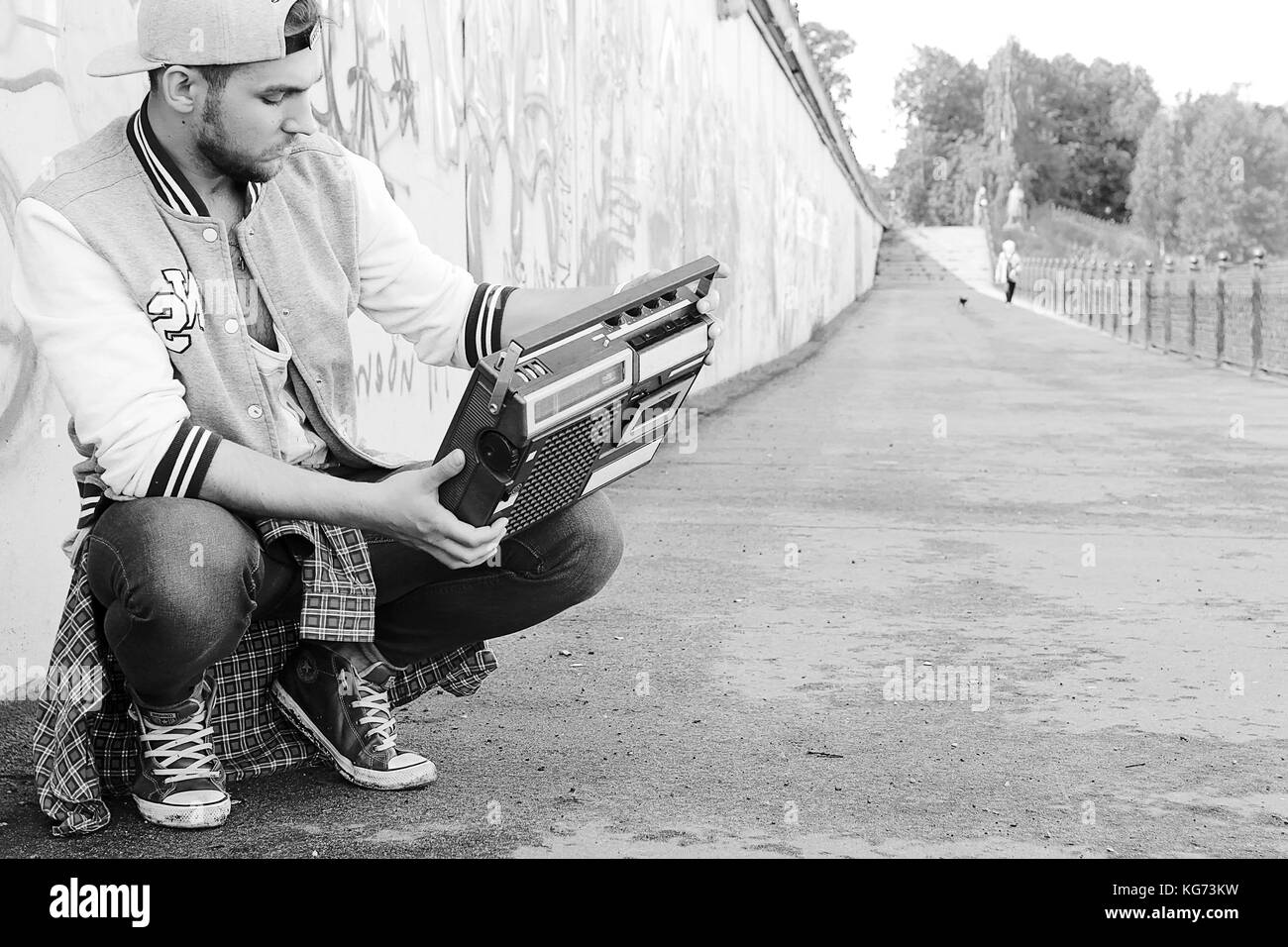 A man dressed in hip hop style poses on camera Stock Photo Alamy