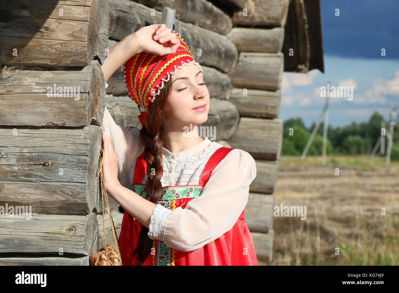 Slavic Modest cute pretty girl in a traditional Slavic dress on nature in an unspoilt ...