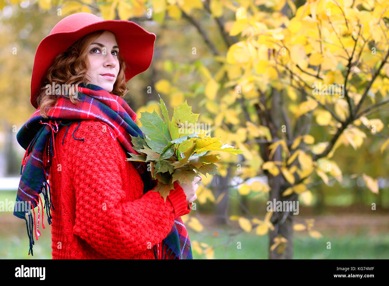Girl on a walk in an autumn park during a fall leaf Stock Photo - Alamy