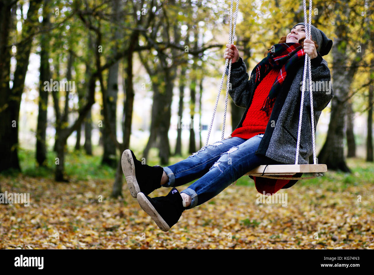 Girl on a walk in an autumn park during a fall leaf Stock Photo - Alamy