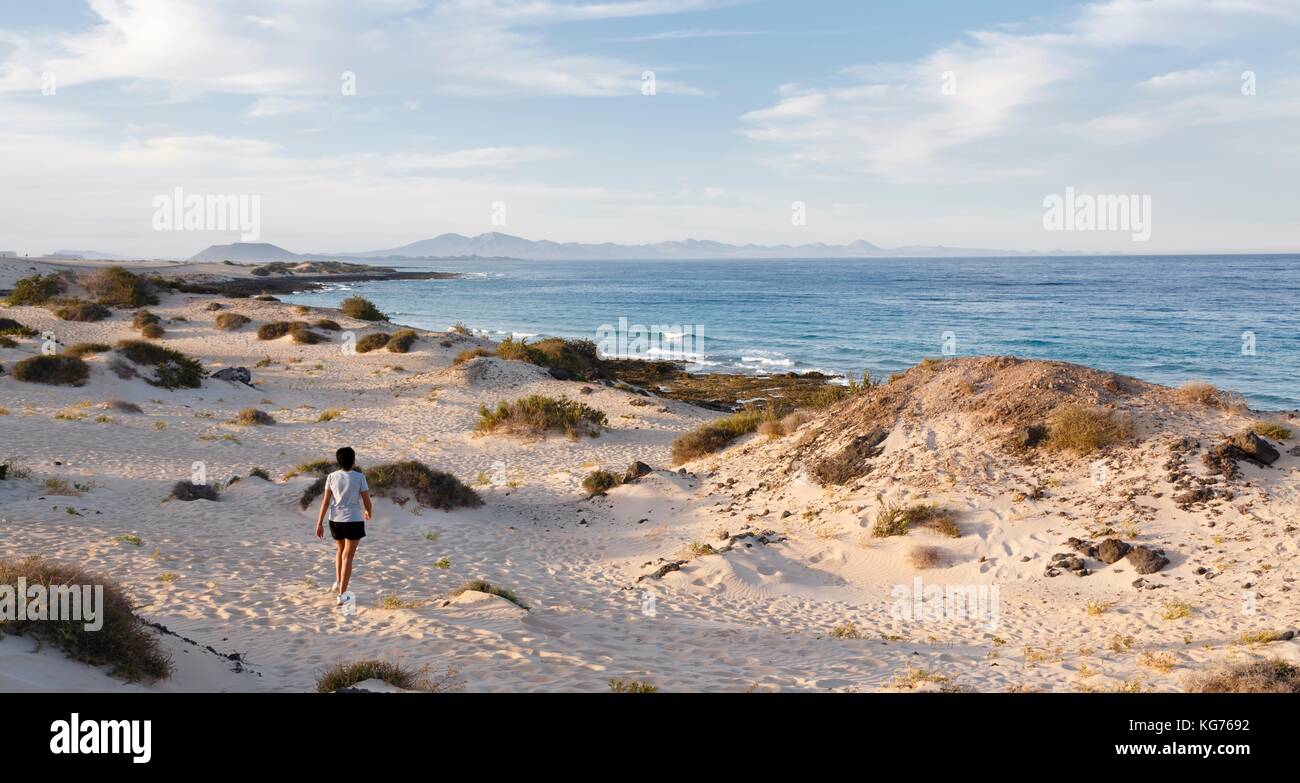 Woman exercising outdoors on a beach in Fuerteventura Stock Photo