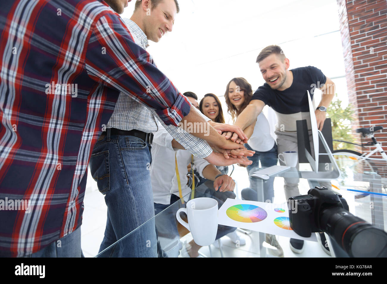 Team meeting are stacked hands in creative office Stock Photo