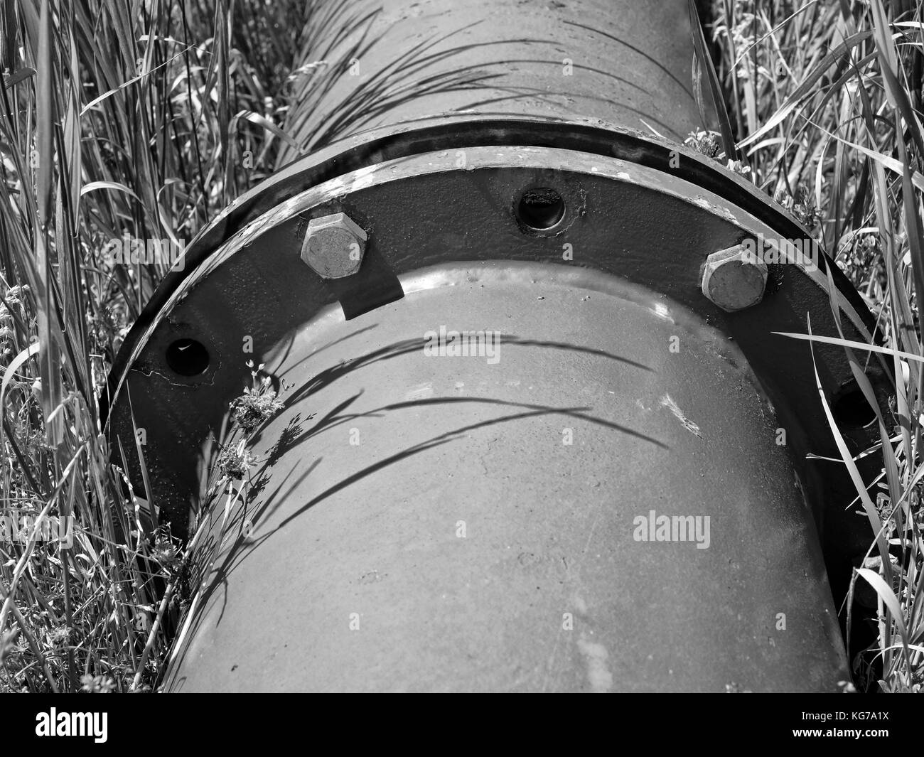 Repaired big drink water pipes joined with new blue flanges and silver