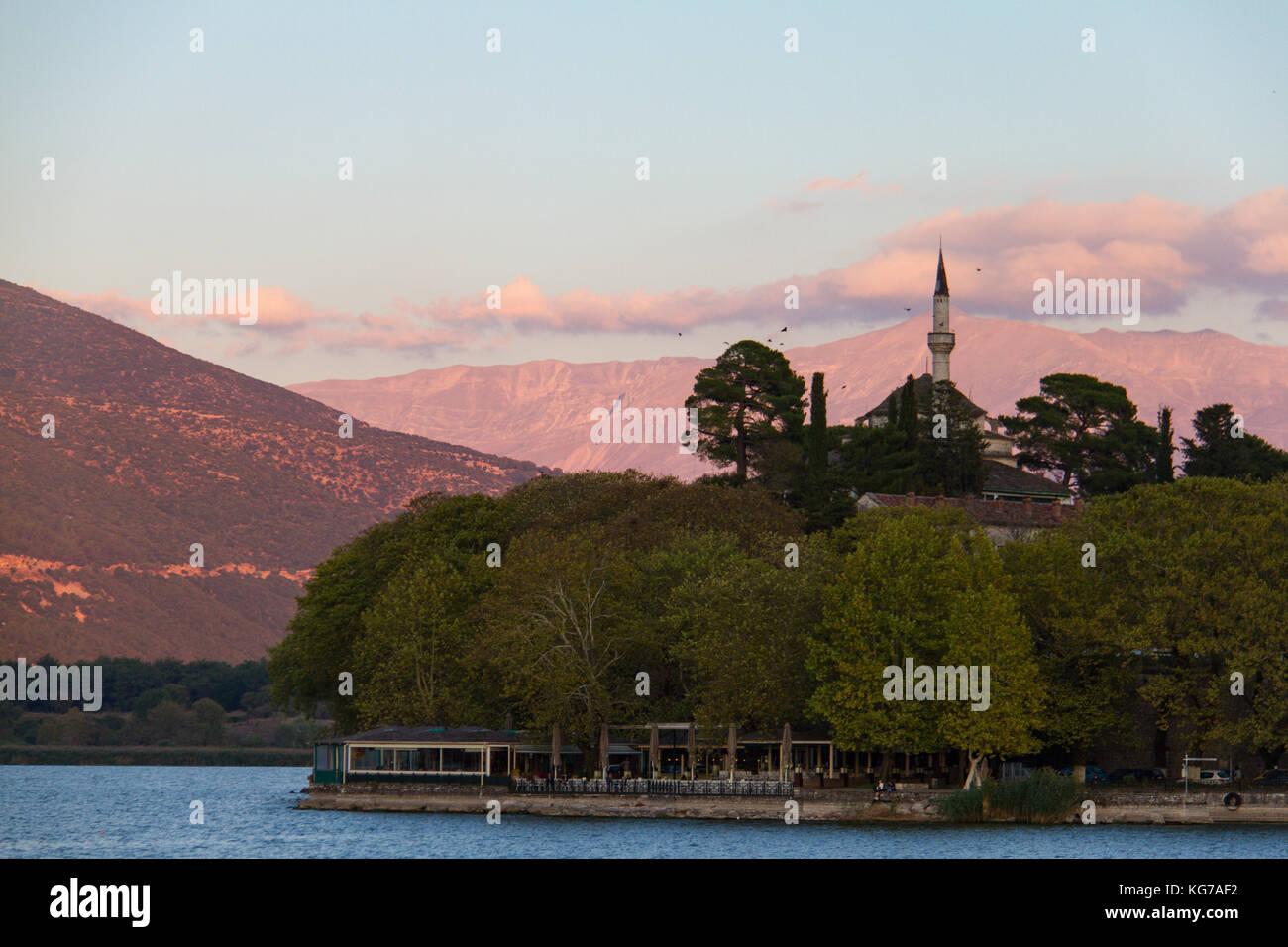Aslan Pasha mosque built on the lake-shore in the city of Ioannina, Greece, bathed in afternoon light Stock Photo