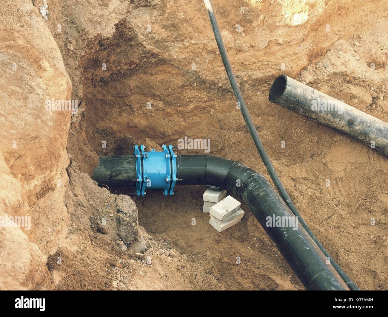 Repairing process of underground water supply pipeline. Black plastic