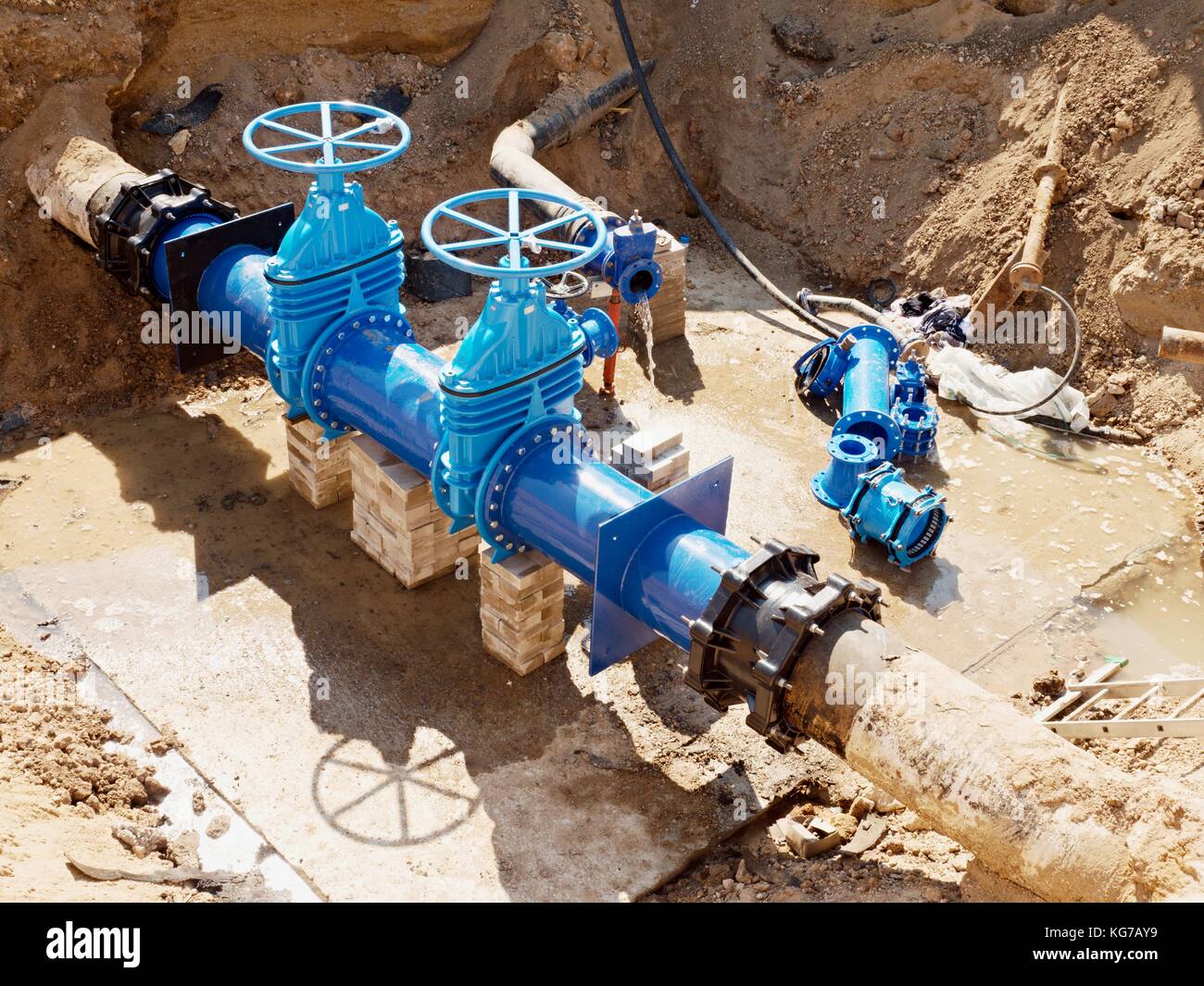 Oil, gas, water industry. Wellhead with valve armature underground. Dug