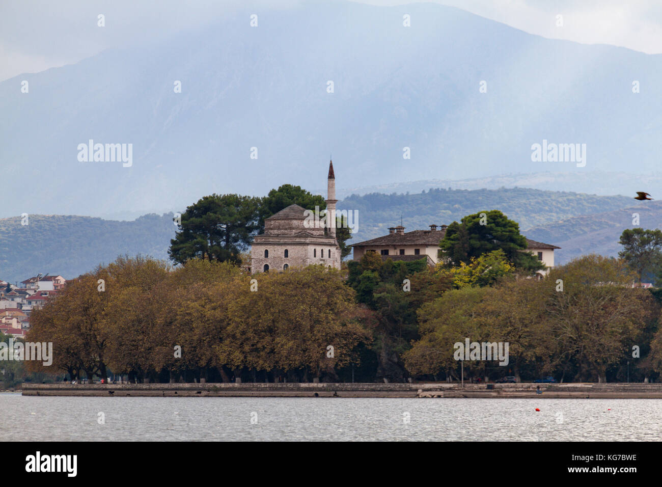 Fetiche Mosque and Byzantine museum viewed from within the lake in Ioannina, Greece Stock Photo