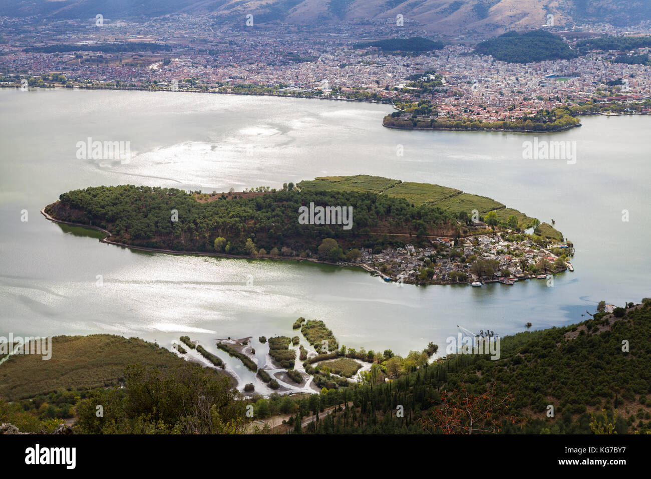 Beautiful view of Ioannina lake from Ligkiades mountain village with the lake island in the foreround and Ioannina city in the background Stock Photo