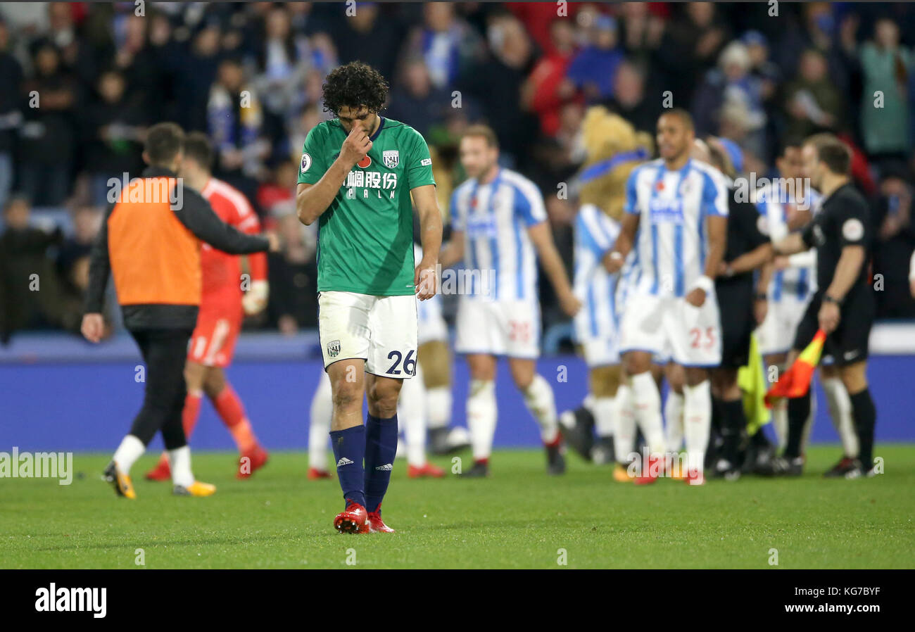 West Bromwich Albion's Ahmed Hegazy shows his dejection after the final whistle of the Premier League match at the John Smith's Stadium, Huddersfield. Stock Photo