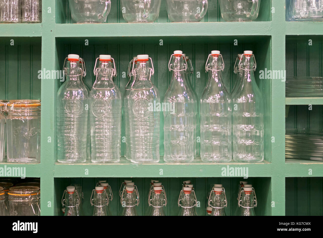 A display of glass storage bottles on shelves in Fish's Eddy on Broadway in lower Manhattan, New York City. Stock Photo