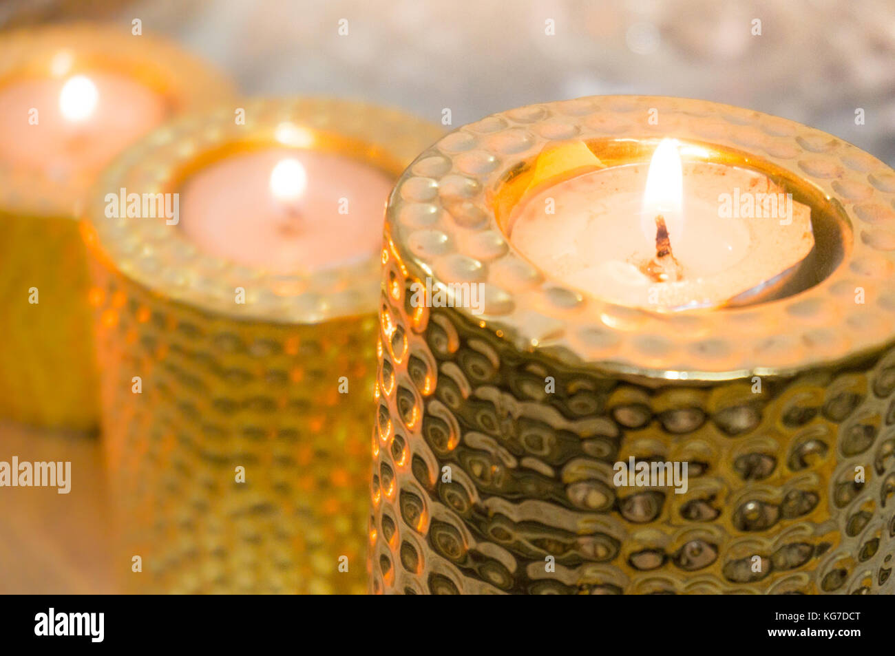 Beautiful golden candle holders with tea lights placed on them. Perfect