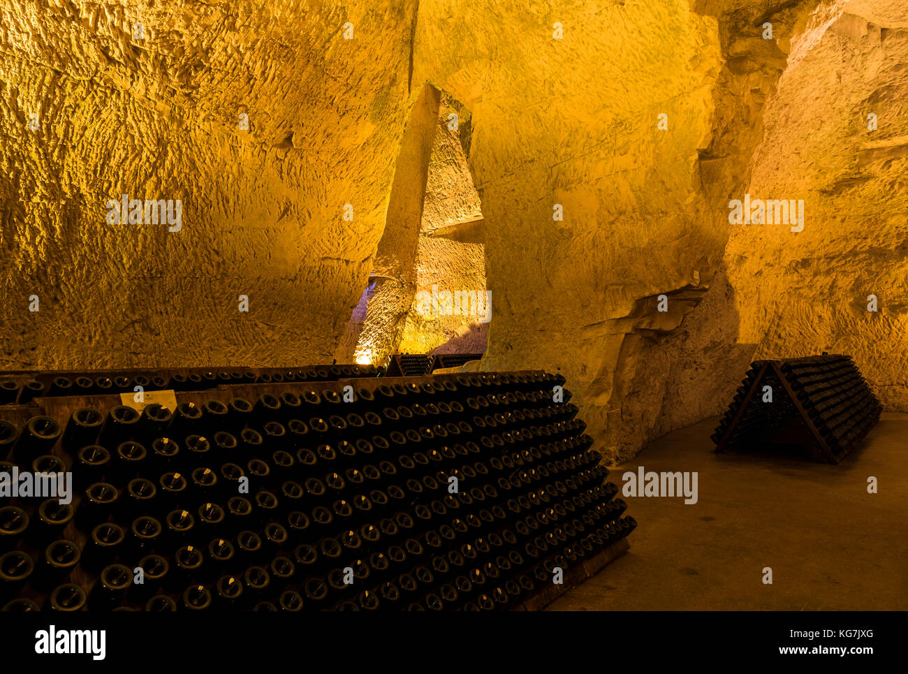 Reims, France - June 12, 2017: the caves of Champagne House Taittinger with old bottles Champagne in pupitres, France. Stock Photo