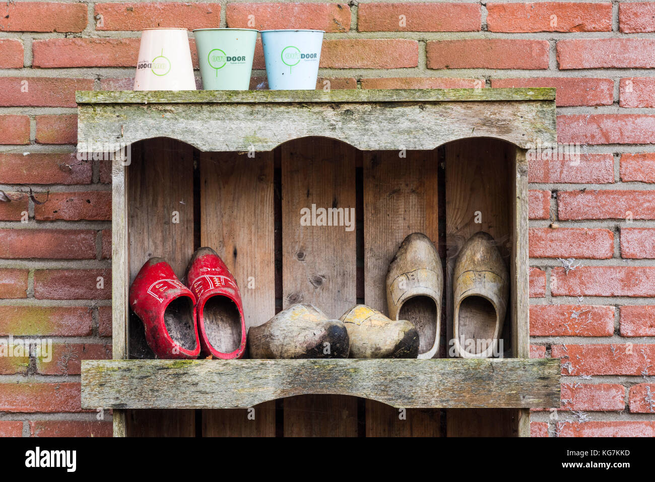 Giethoorn, The Netherlands - November 11, 2016: Three pair of wooden shoes in the small town of Giethoorn, Overijssel. Stock Photo