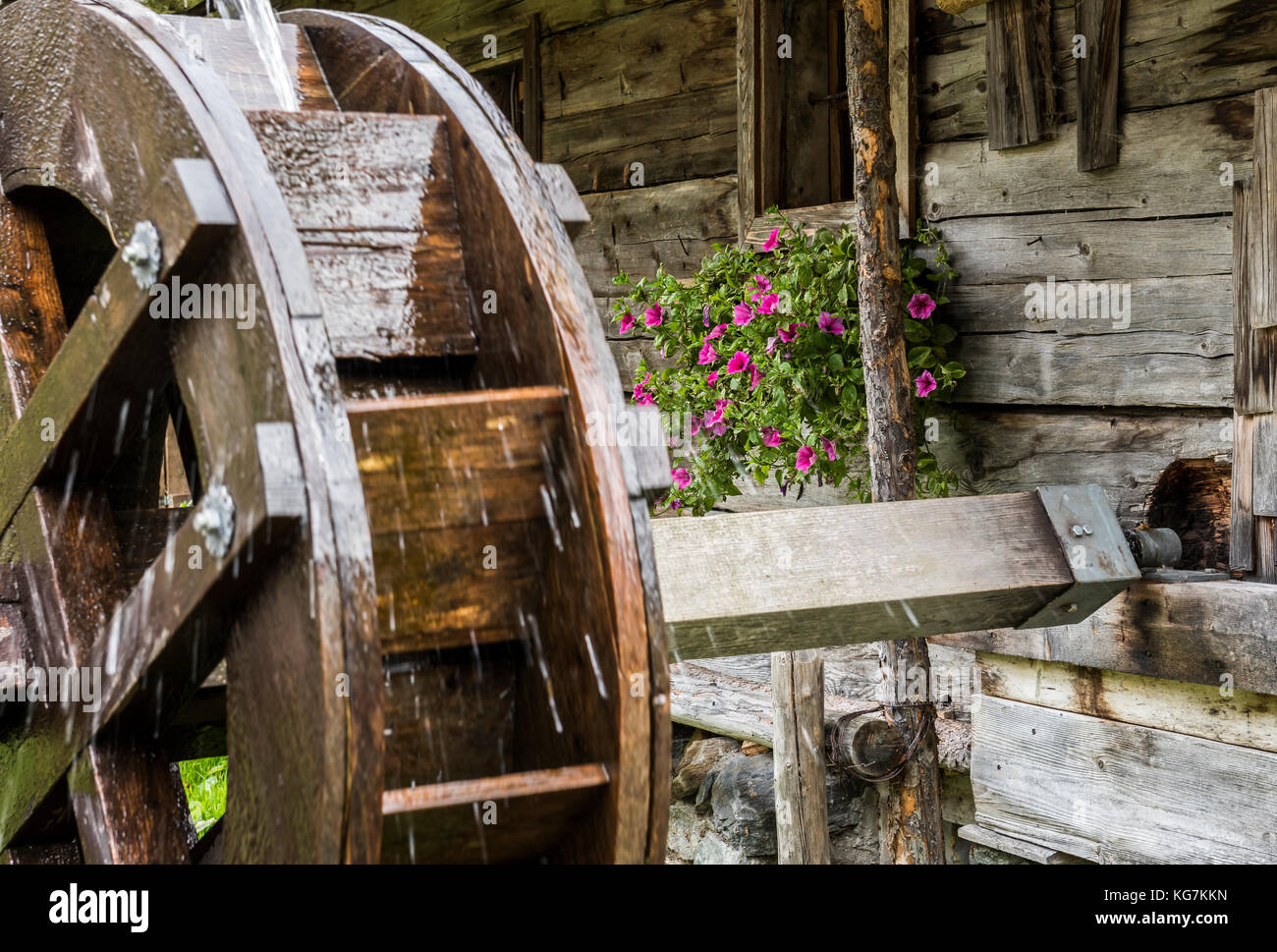 Habachtal, Austria - September 29, 2017: Water Wheel at the Thuringer Hutte with old cabin in the valley with the Smaragdweg, Austria. Stock Photo