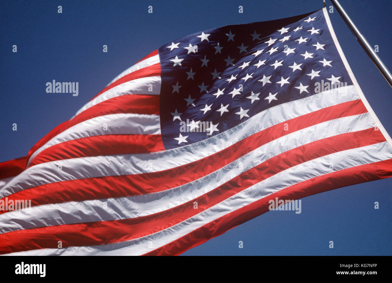 The US flag flying in the breeze. 1986. Stock Photo