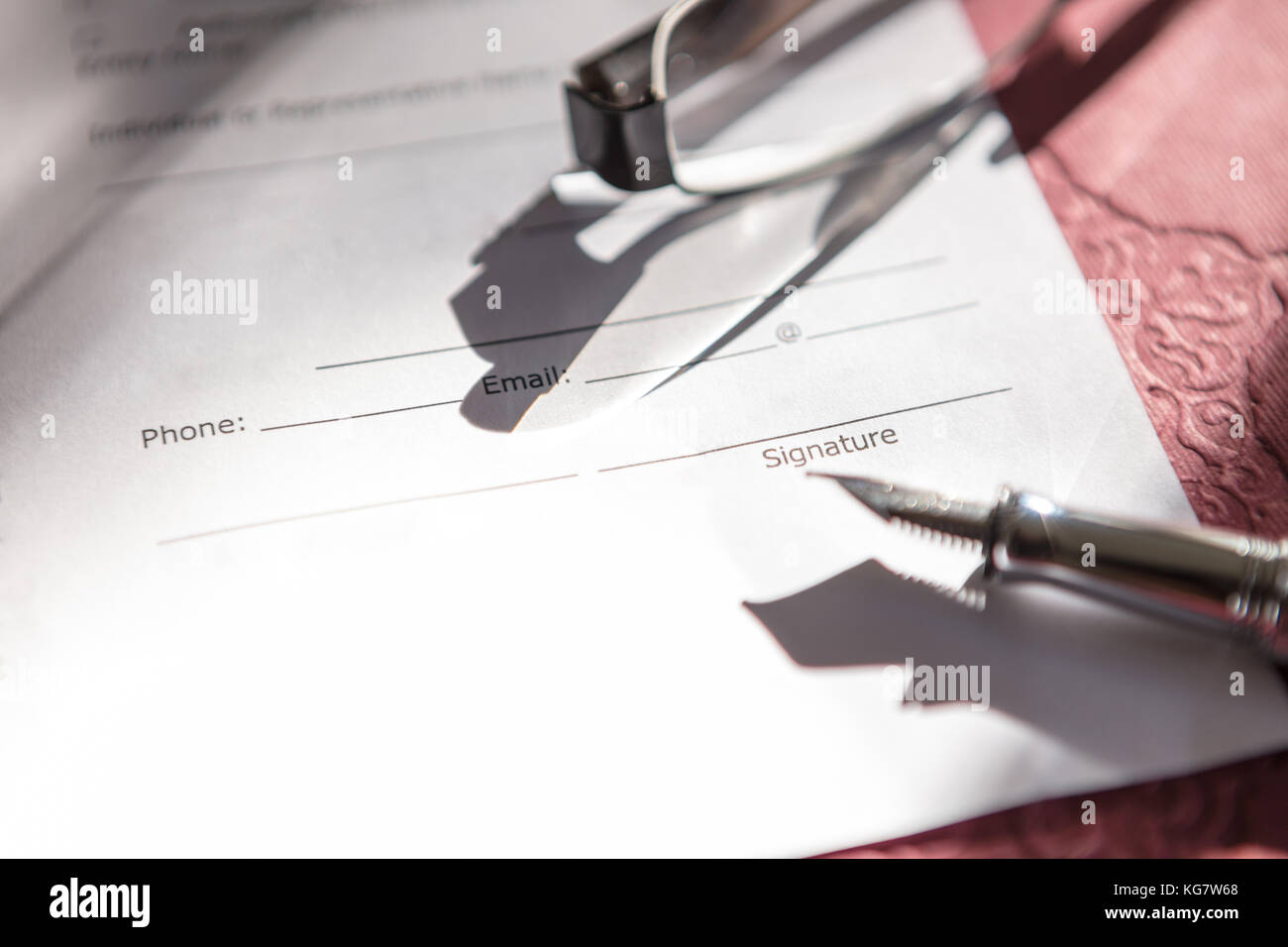 Close-up of Contract form with fountain pen and glasses Stock Photo