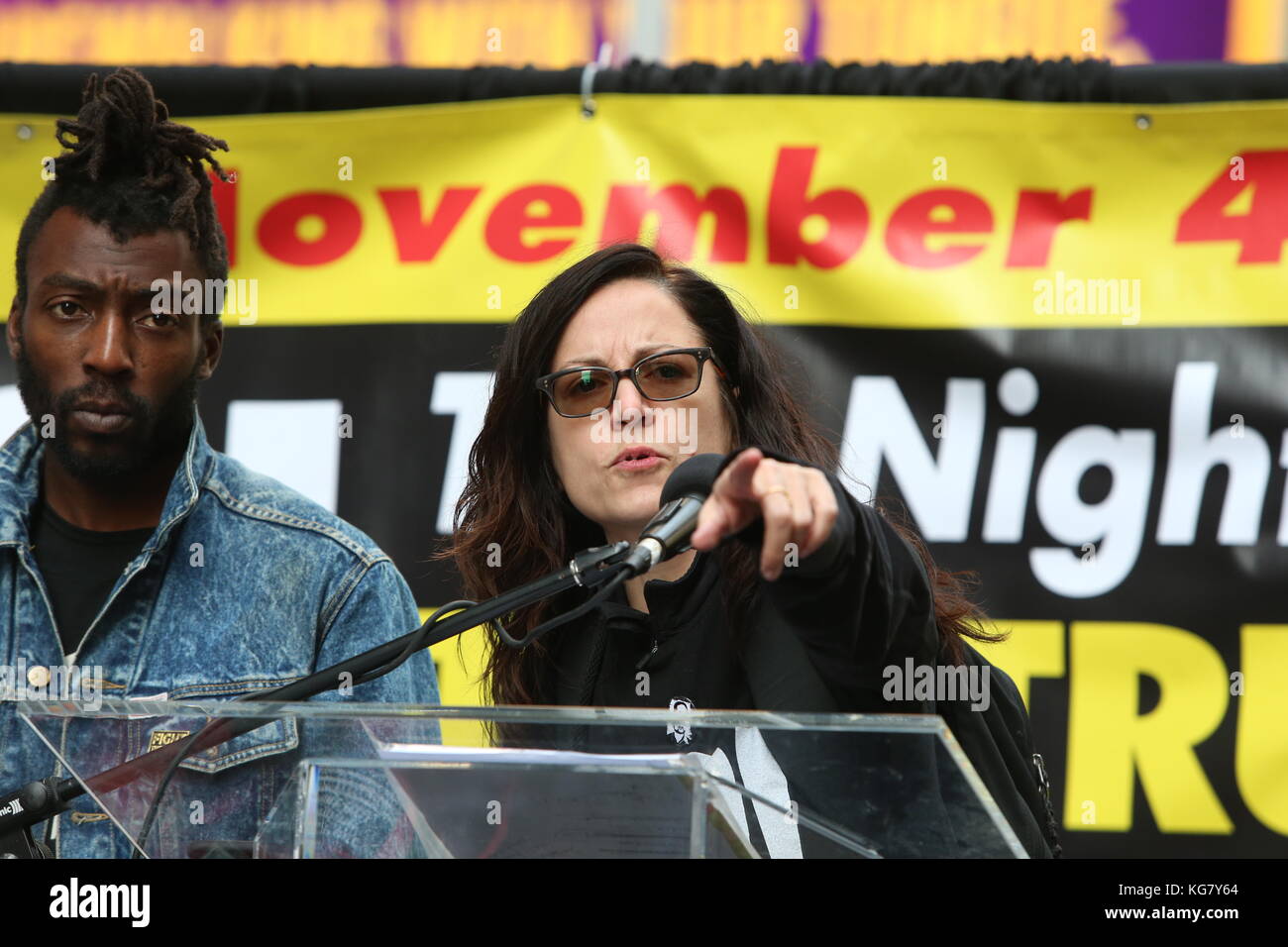 Manhattan, United States. 04th Nov, 2017. Jamal Mims and Sunsara Taylor on stage. Activists from Revolutionary Club of New York staged a rally in Times Square calling for a week of solid action in mark the one year anniversary of Donald Trump's upset victory against Hillary Clinton Credit: Andy Katz/Pacific Press/Alamy Live News Stock Photo