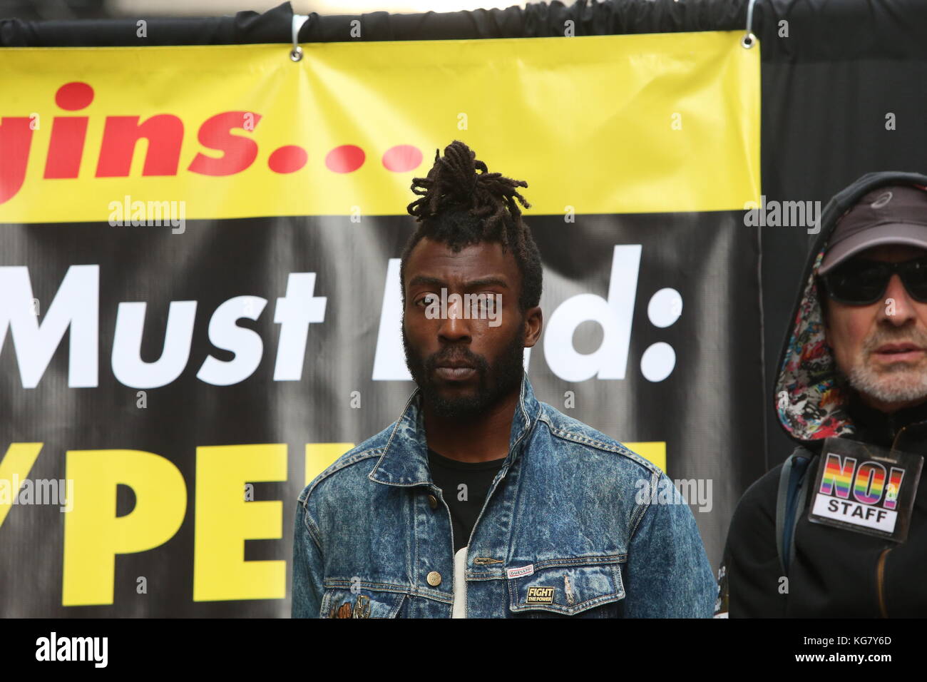 Manhattan, United States. 04th Nov, 2017. Jamal Mims of RevCom on stage. Activists from Revolutionary Club of New York staged a rally in Times Square calling for a week of solid action in mark the one year anniversary of Donald Trump's upset victory against Hillary Clinton Credit: Andy Katz/Pacific Press/Alamy Live News Stock Photo