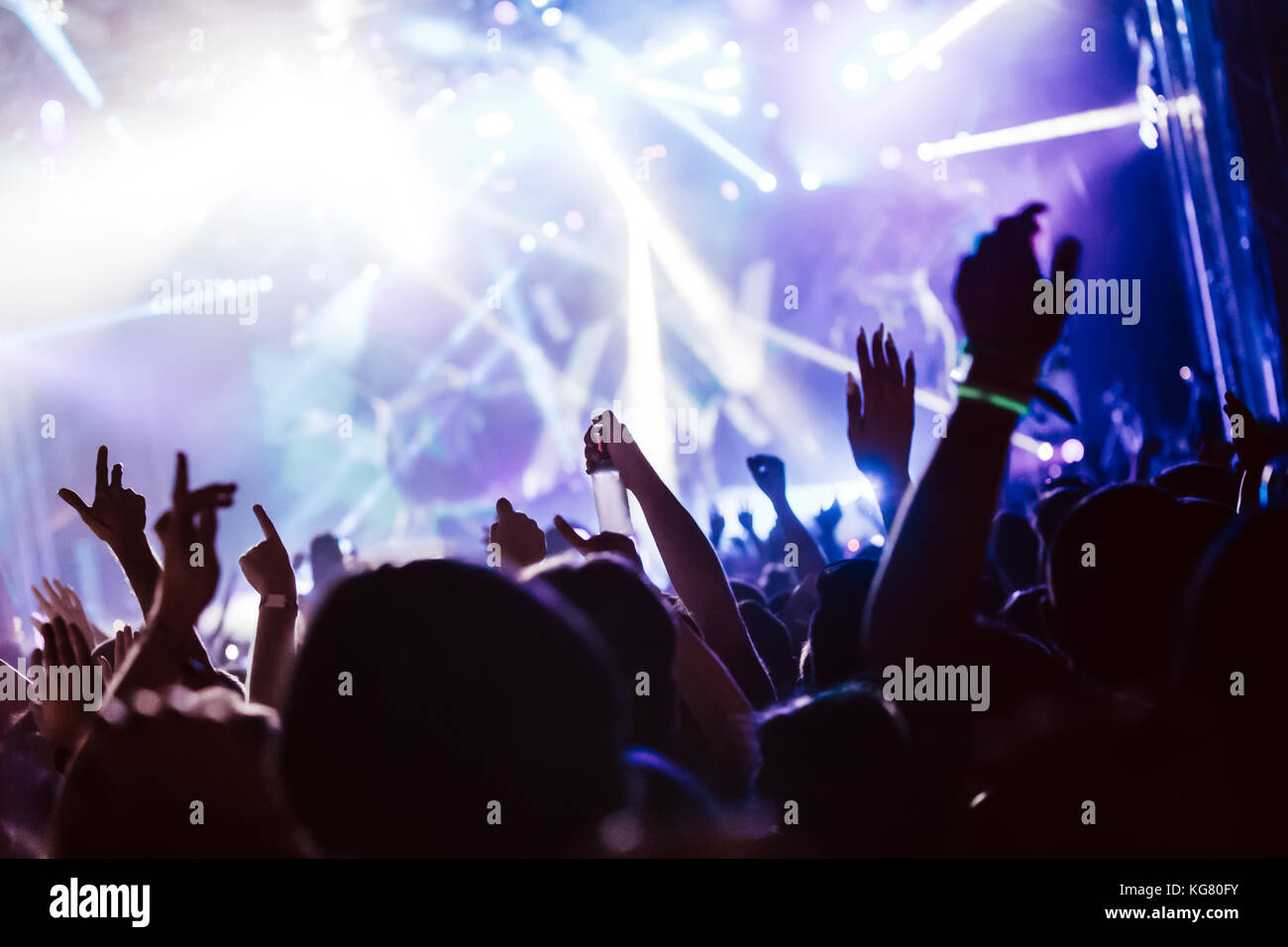 Cheering crowd at concert enjoying music performance Stock Photo - Alamy