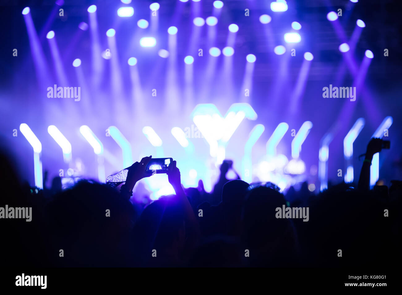 Cheering crowd with hands in air at music festival Stock Photo - Alamy