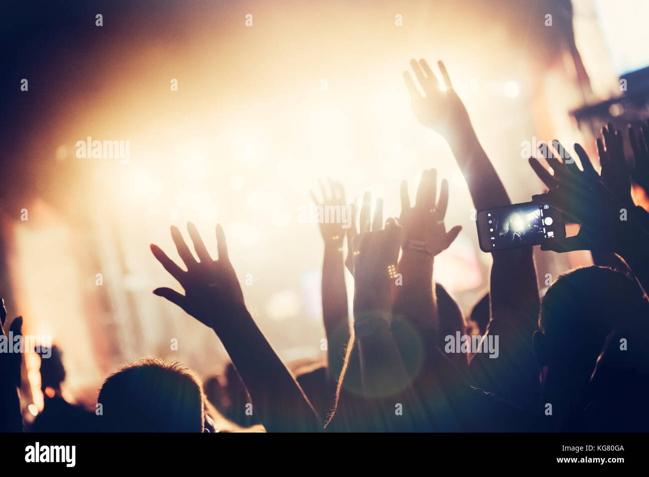 Cheering crowd with hands in air at music festival Stock Photo - Alamy