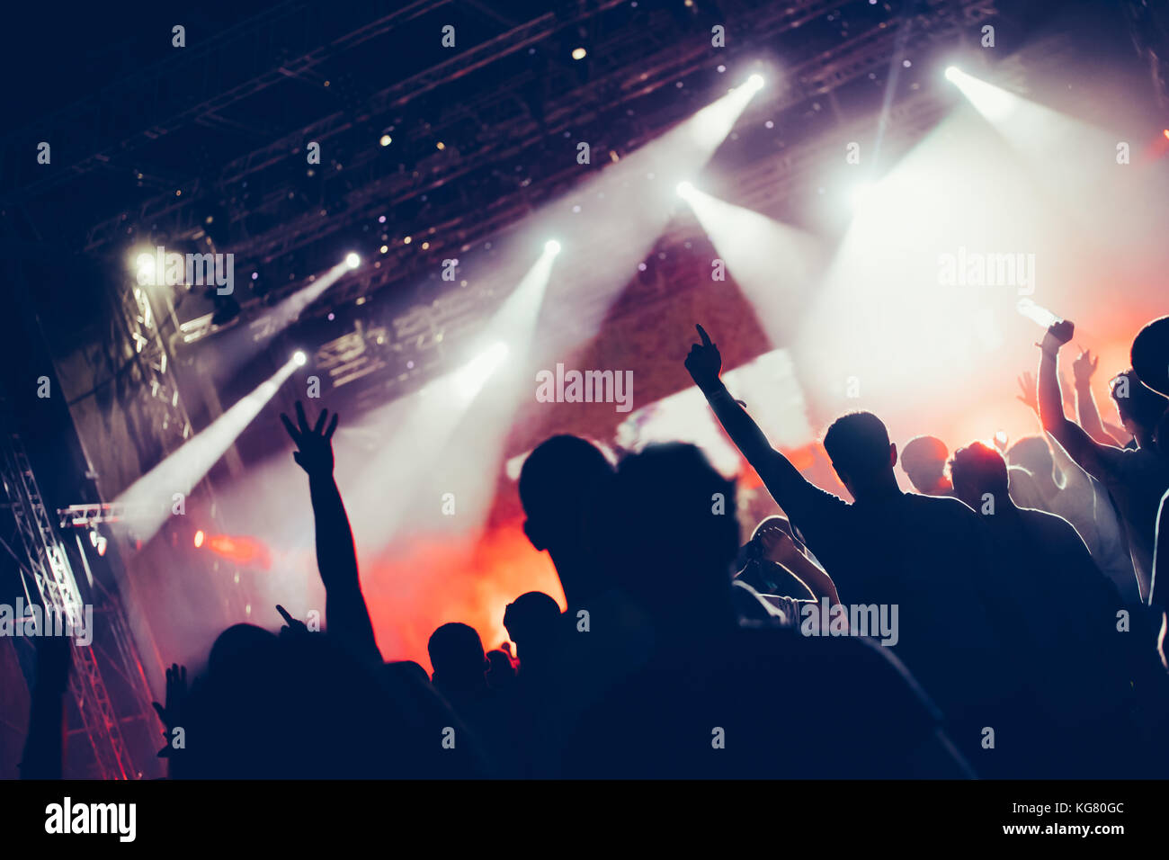 Cheering crowd with hands in air at music festival Stock Photo - Alamy