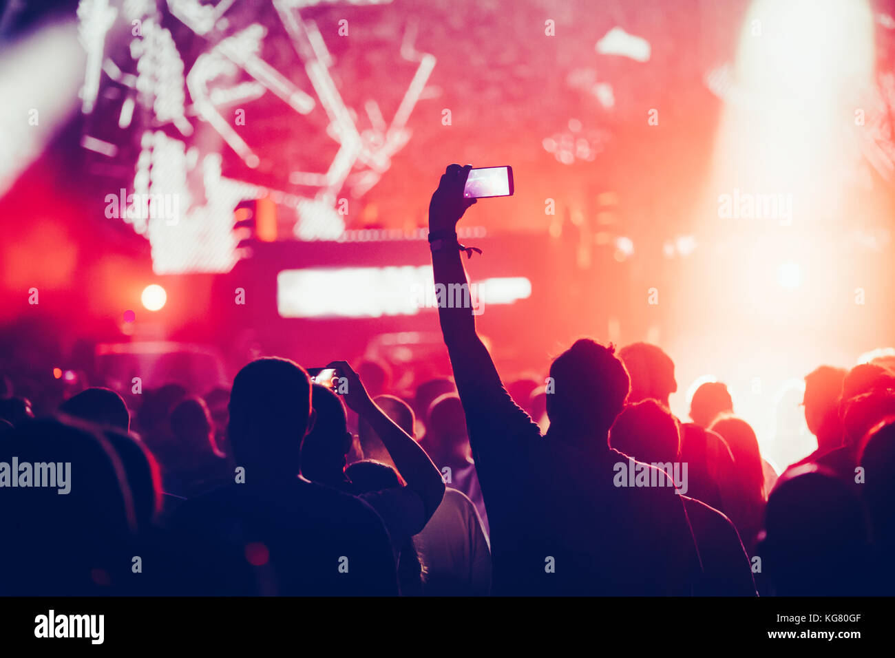 Cheering crowd with hands in air at music festival Stock Photo - Alamy