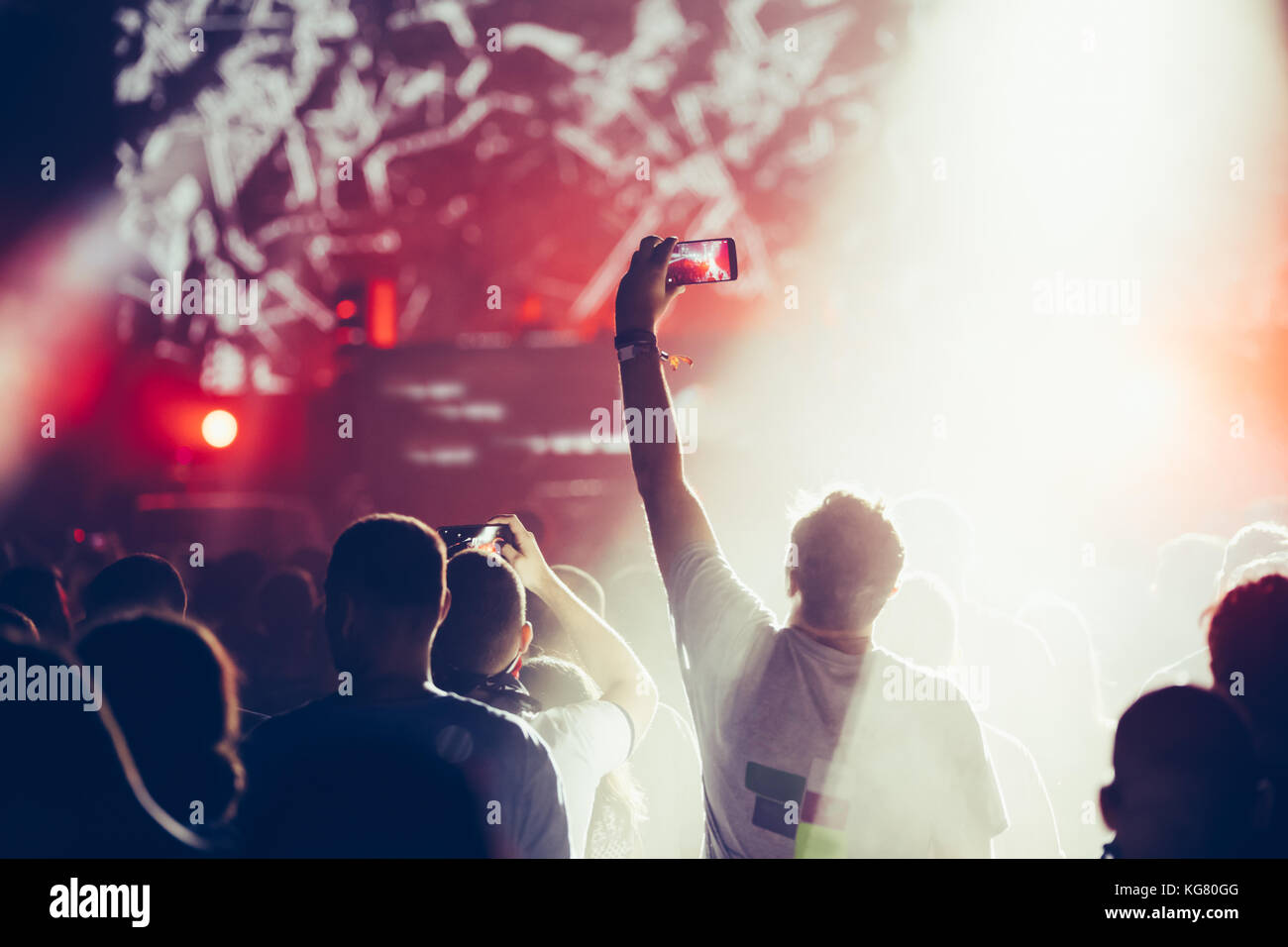 Cheering crowd with hands in air at music festival Stock Photo - Alamy