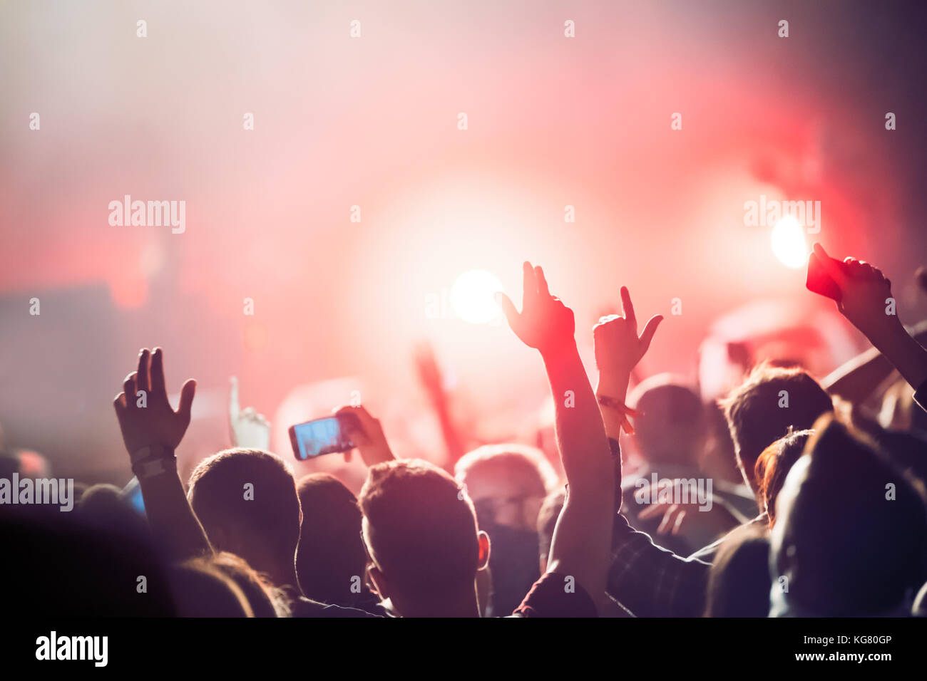 Cheering crowd with hands in air at music festival Stock Photo Alamy