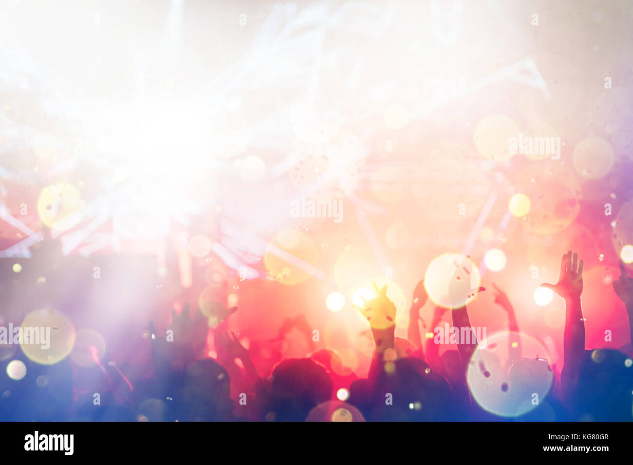 Cheering crowd with hands in air at music festival Stock Photo