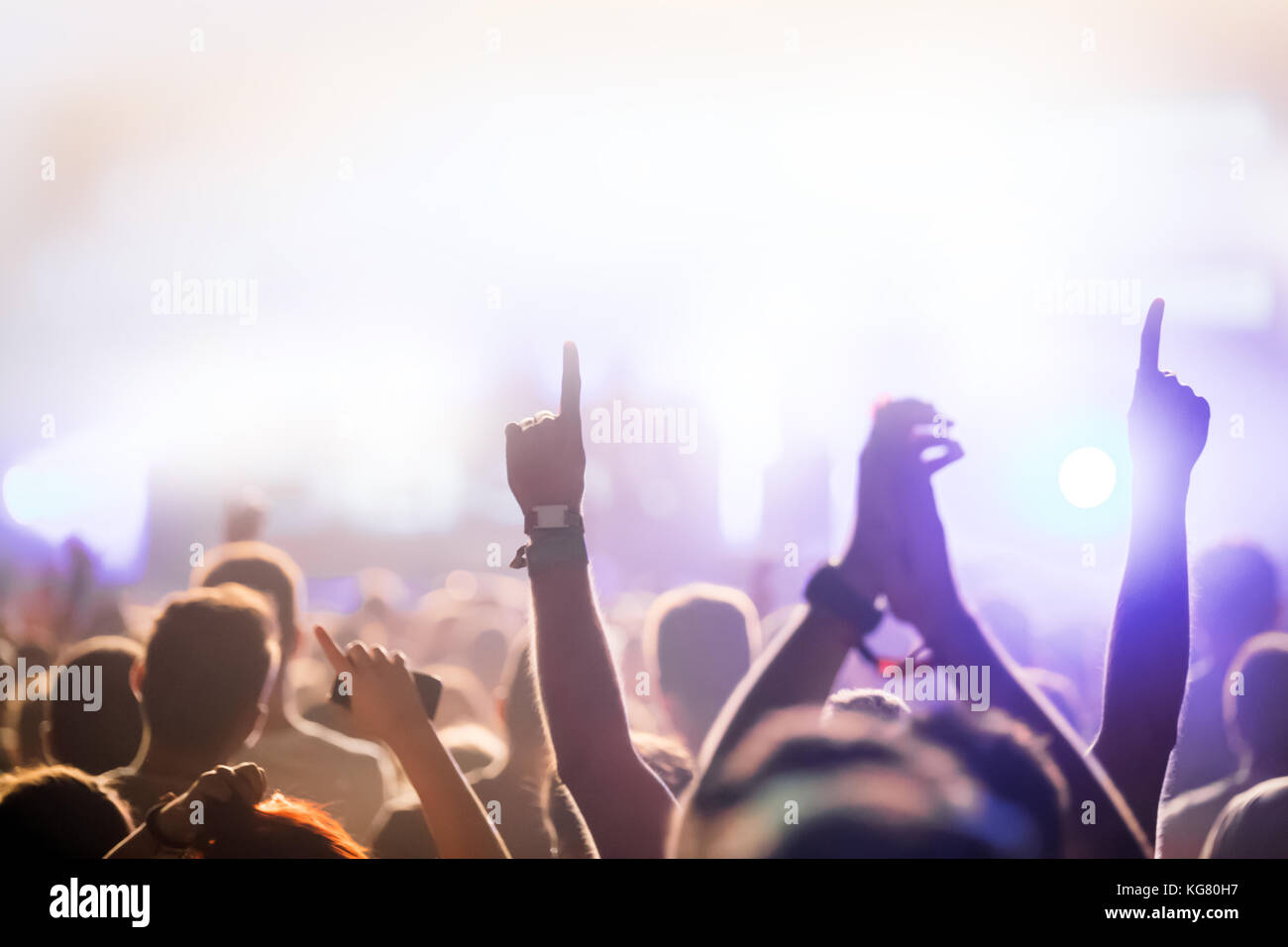 Cheering crowd with hands in air at music festival Stock Photo - Alamy