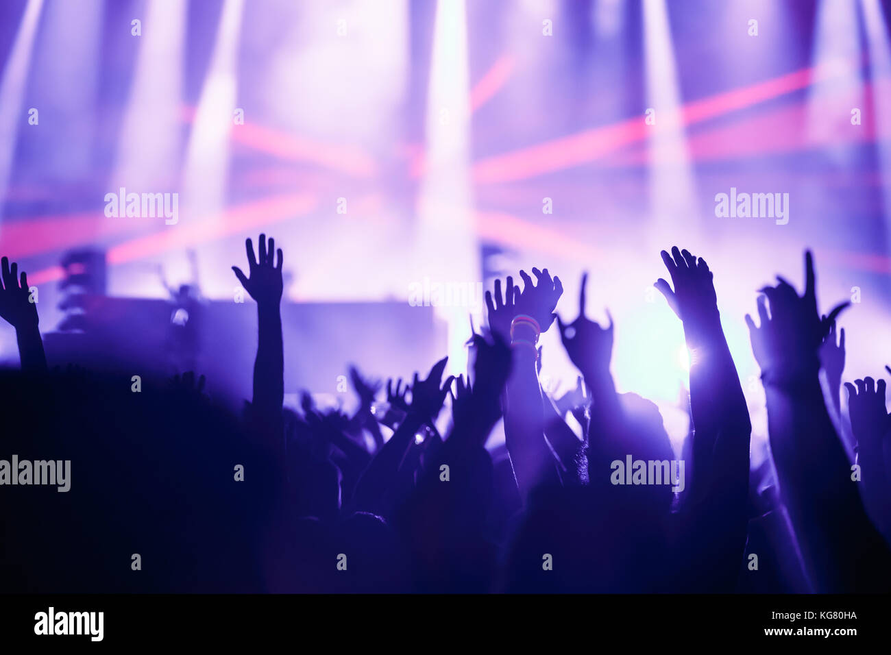 Cheering crowd with hands in air at music festival Stock Photo - Alamy
