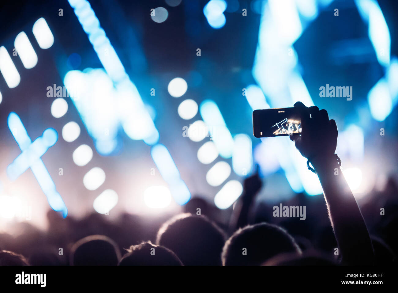 Cheering crowd with hands in air at music festival Stock Photo - Alamy