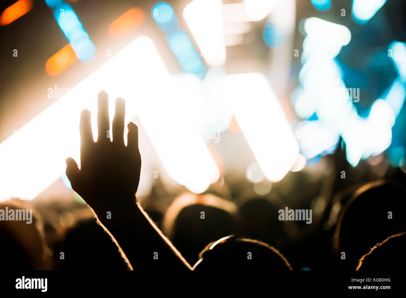 Cheering crowd with hands in air at music festival Stock Photo - Alamy