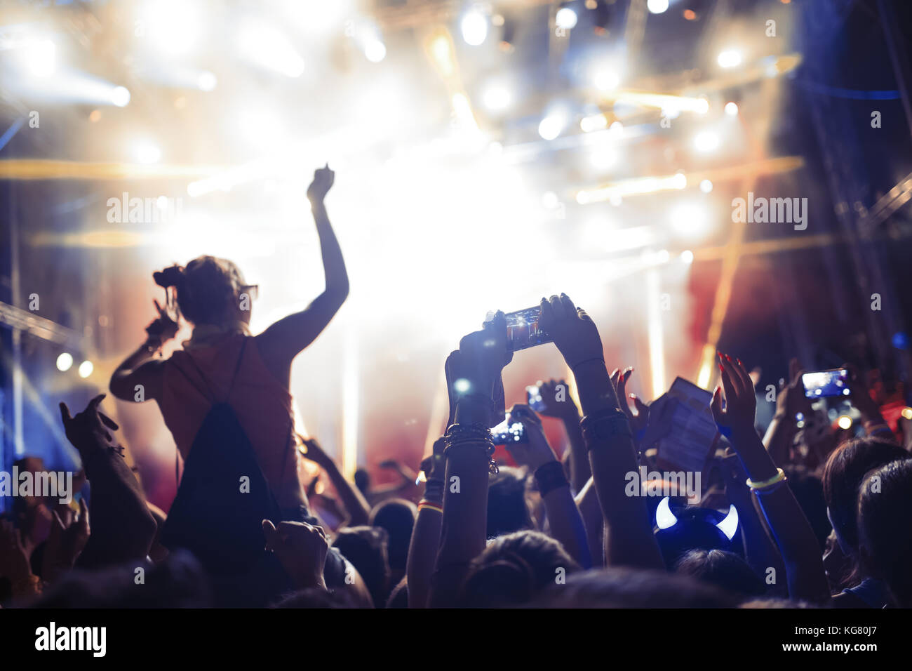 Portrait of happy crowd enjoying at music festival Stock Photo