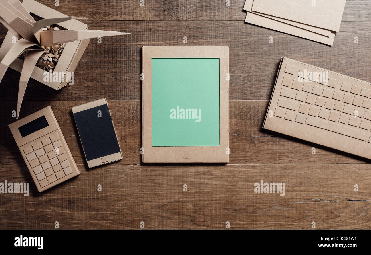 Creative ecofriendly office desk with tablet, smartphone and objects