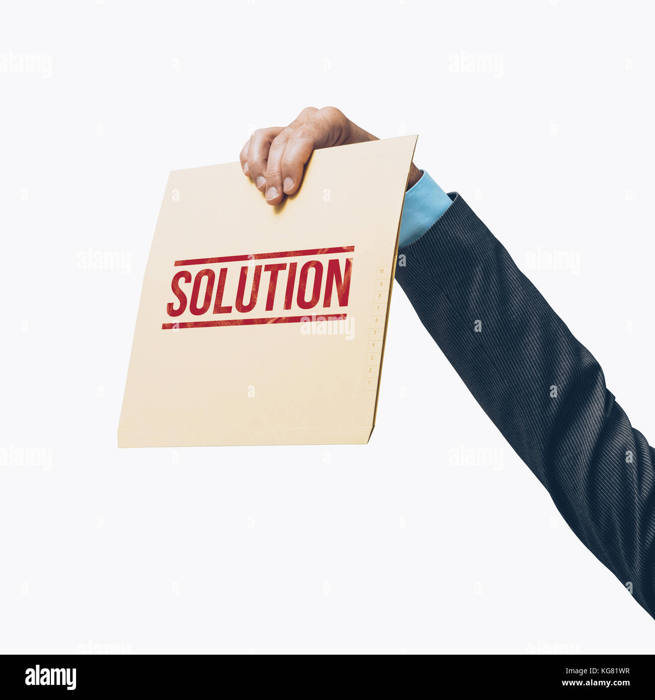 Businessman holding a file with solutions on white background Stock Photo